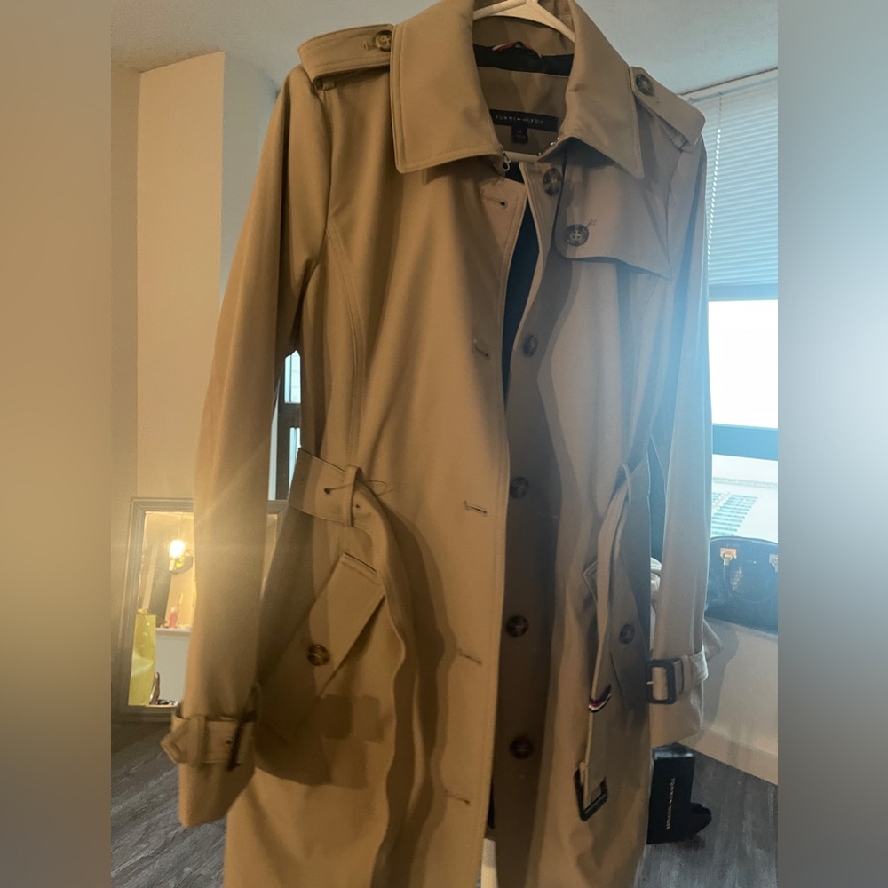 Brand new Tommy Hilfiger trench coat with tags .